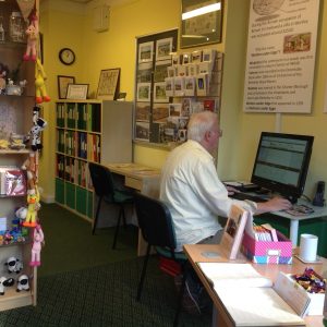 Man working at desk on computer 